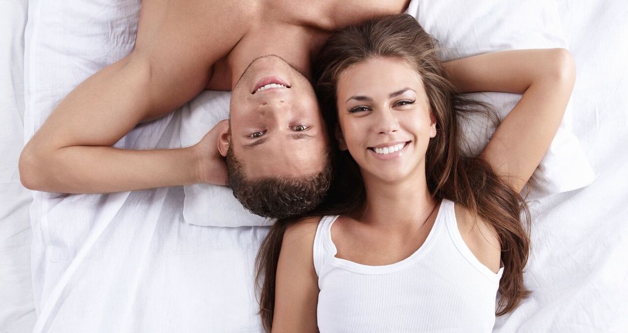 a woman in bed with a man who has increased her potential
